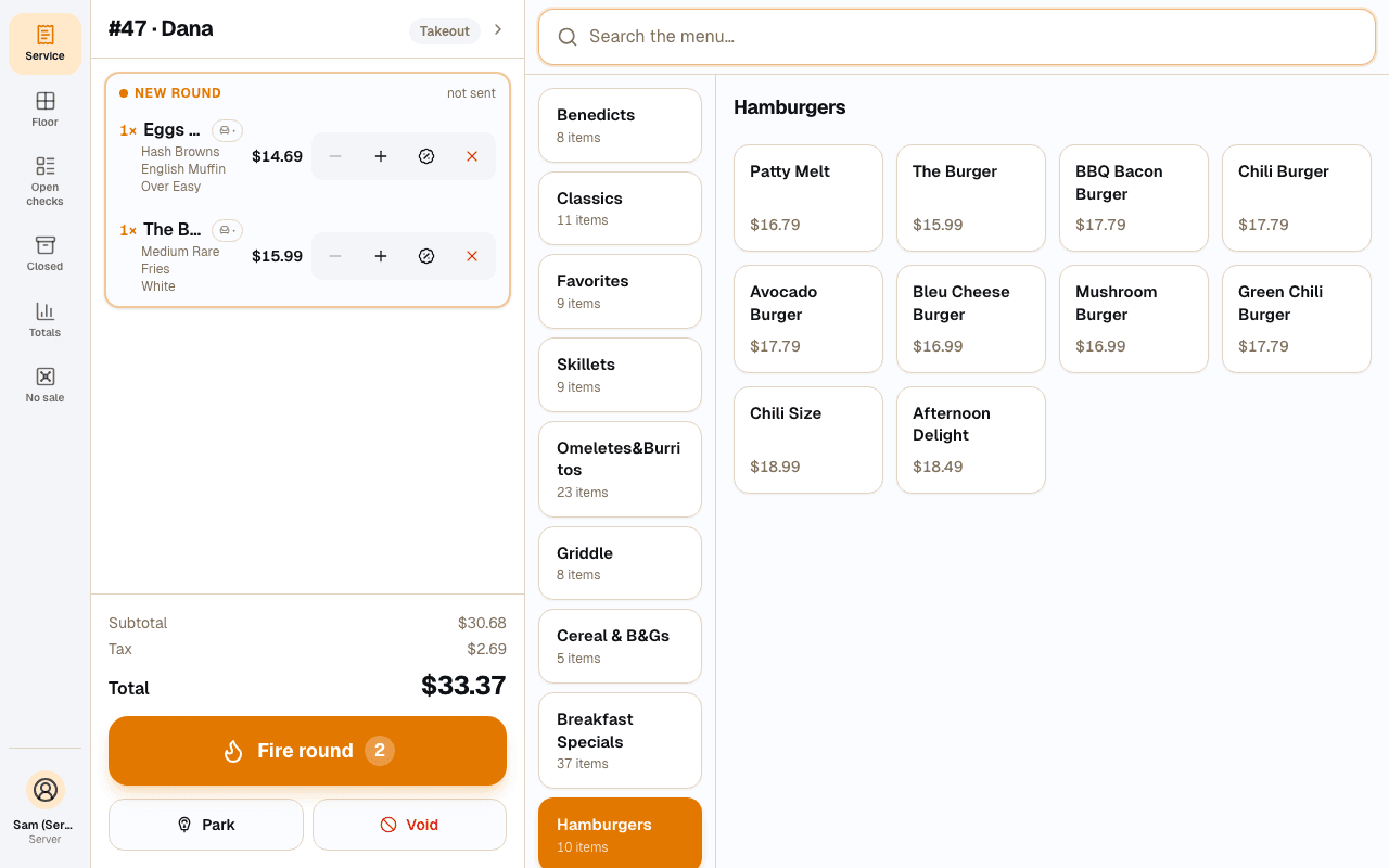 Ampia server POS with an open ticket and the menu grid